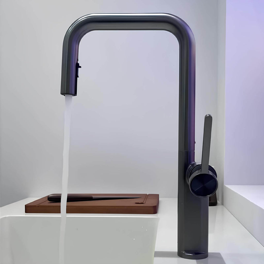 Designer brass kitchen faucet with pull-down sprayer and rotating spout