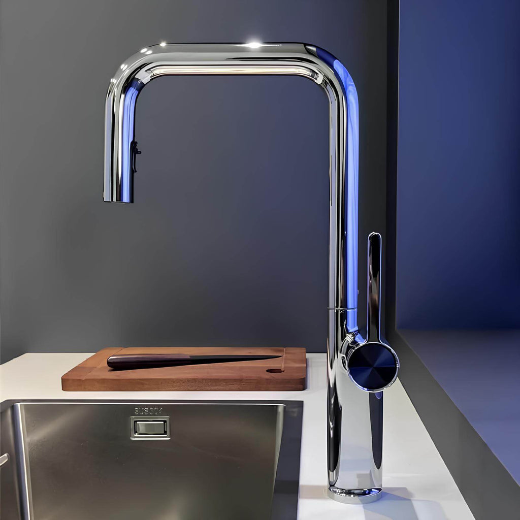 Designer brass kitchen faucet with pull-down sprayer and rotating spout