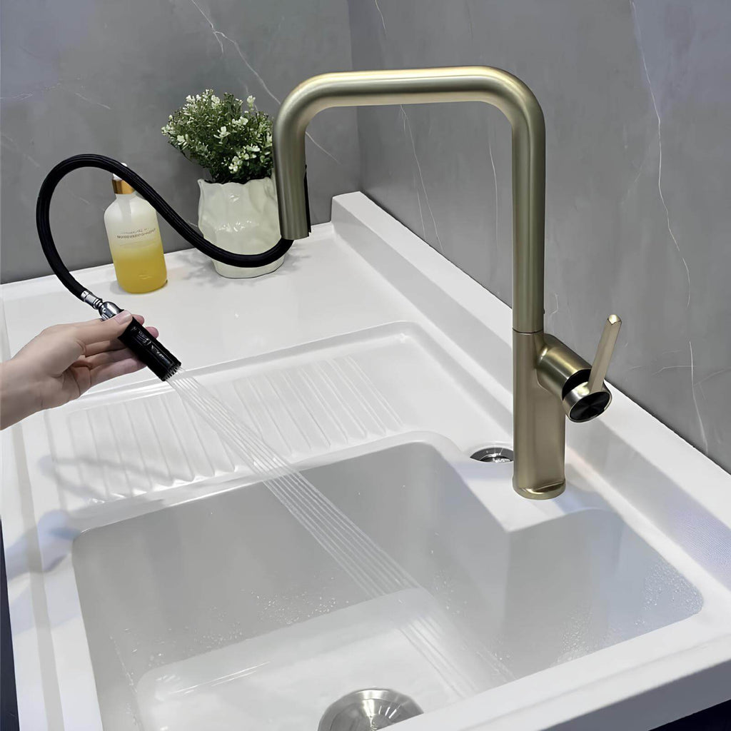 Designer brass kitchen faucet with pull-down sprayer and rotating spout