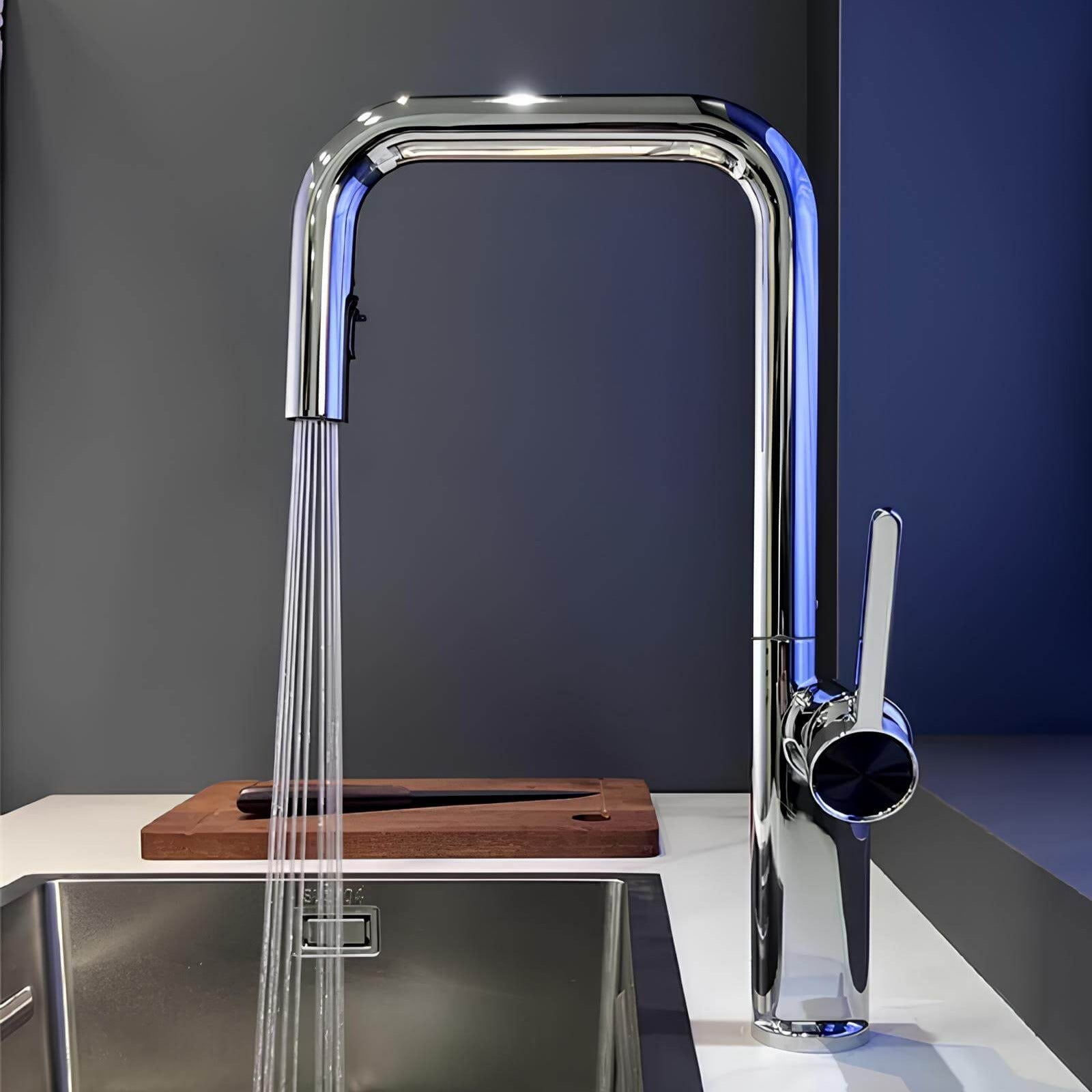 Designer brass kitchen faucet with pull-down sprayer and rotating spout