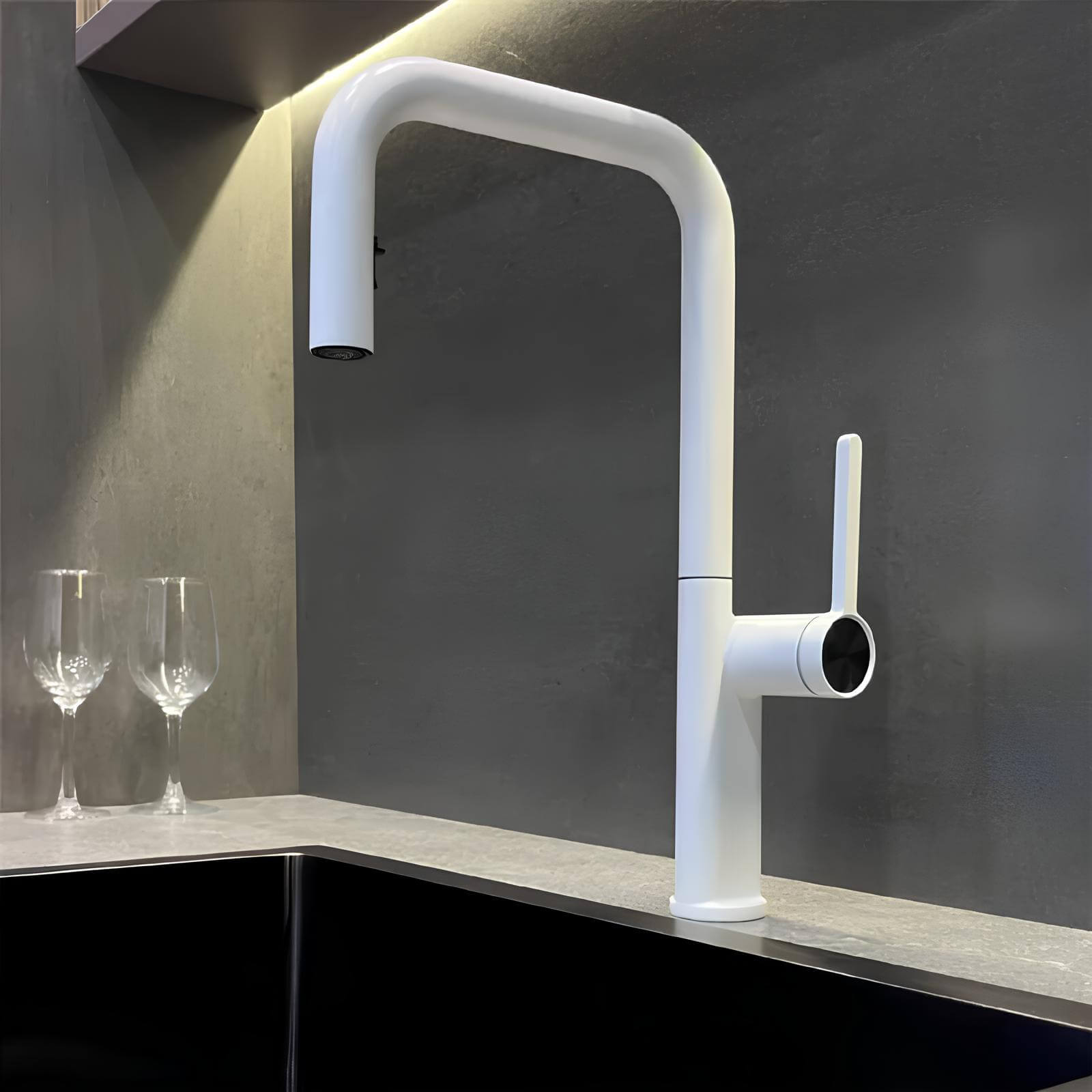 Designer brass kitchen faucet with pull-down sprayer and rotating spout