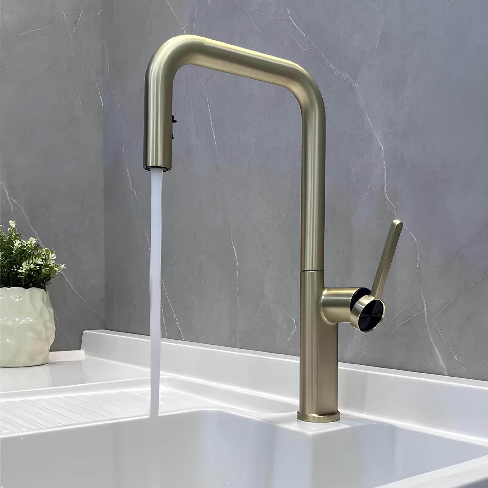 Designer brass kitchen faucet with pull-down sprayer and rotating spout