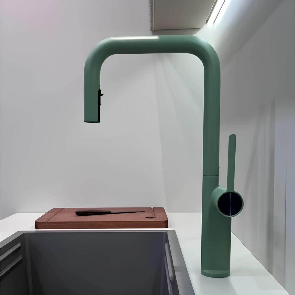 Designer brass kitchen faucet with pull-down sprayer and rotating spout