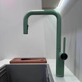Designer brass kitchen faucet with pull-down sprayer and rotating spout