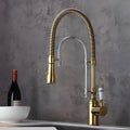 Brass kitchen mixer with tall spring and flexible dual-spray sprayer