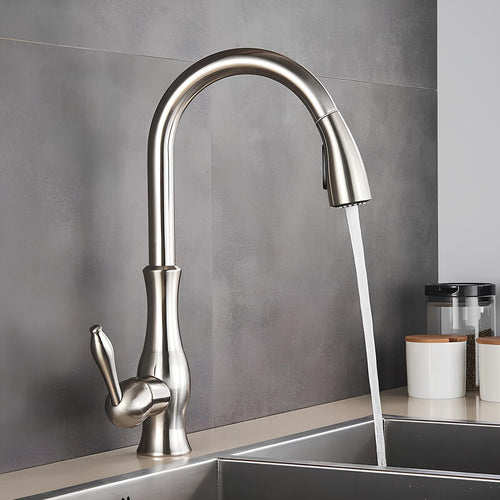 Brass kitchen mixer with hidden retractable sprayer and swivel neck