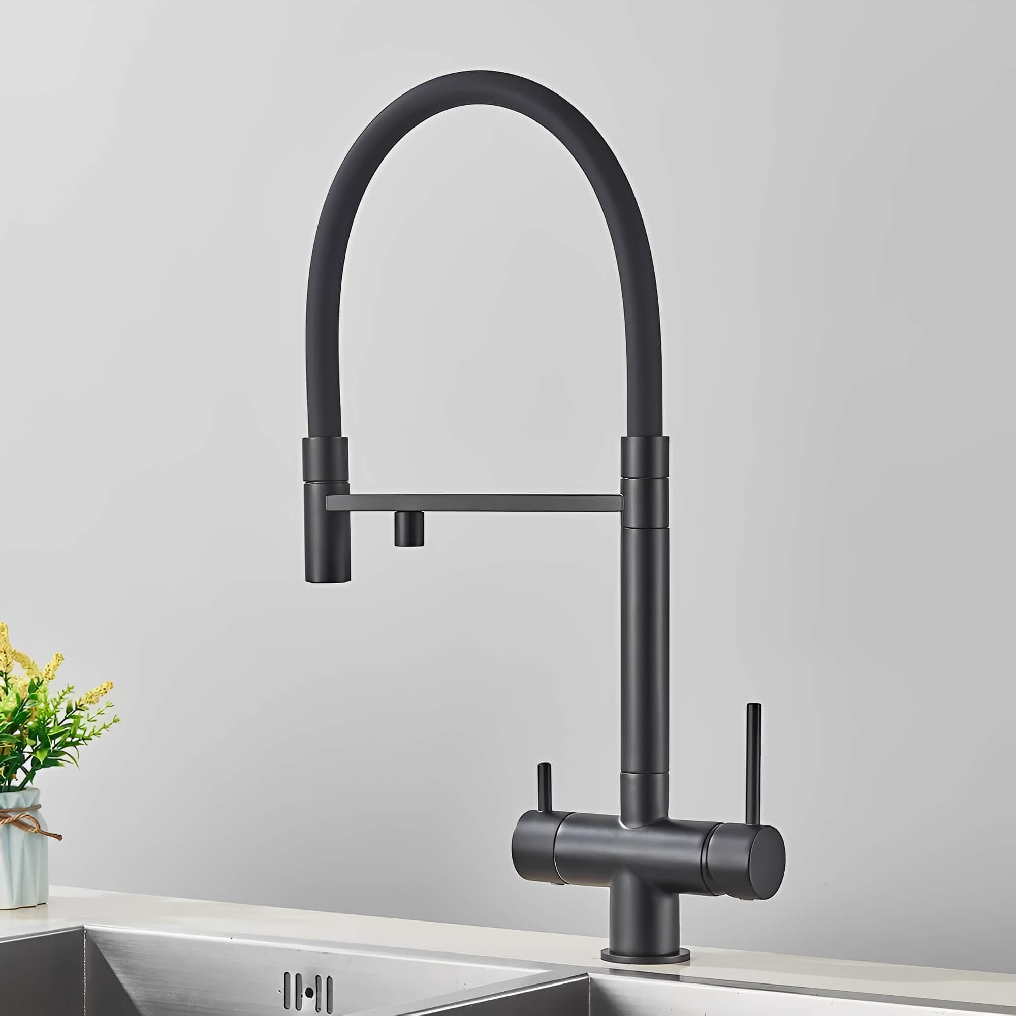 Kitchen faucet with pull-down sprayer and filtered water outlet