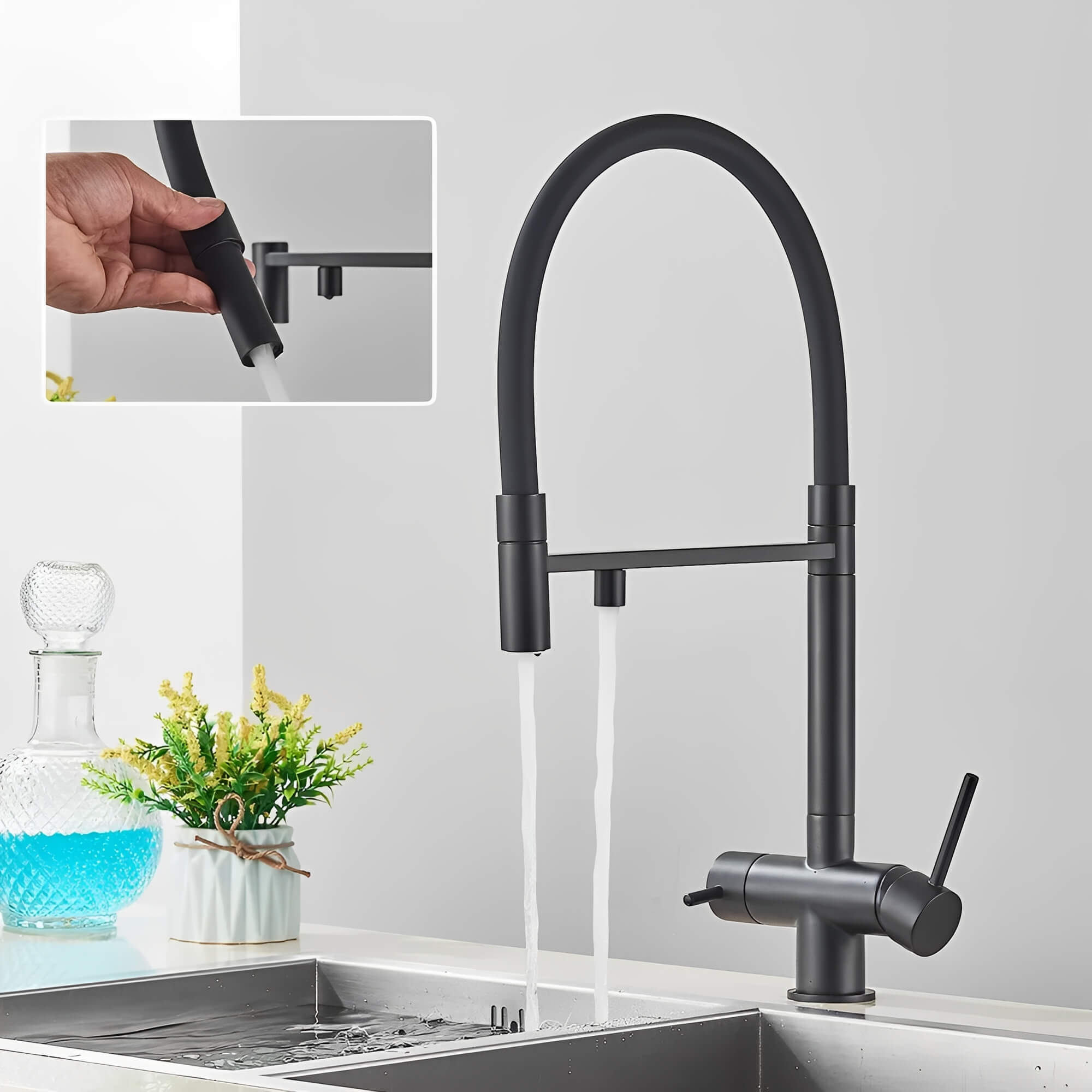 Kitchen faucet with pull-down sprayer and filtered water outlet
