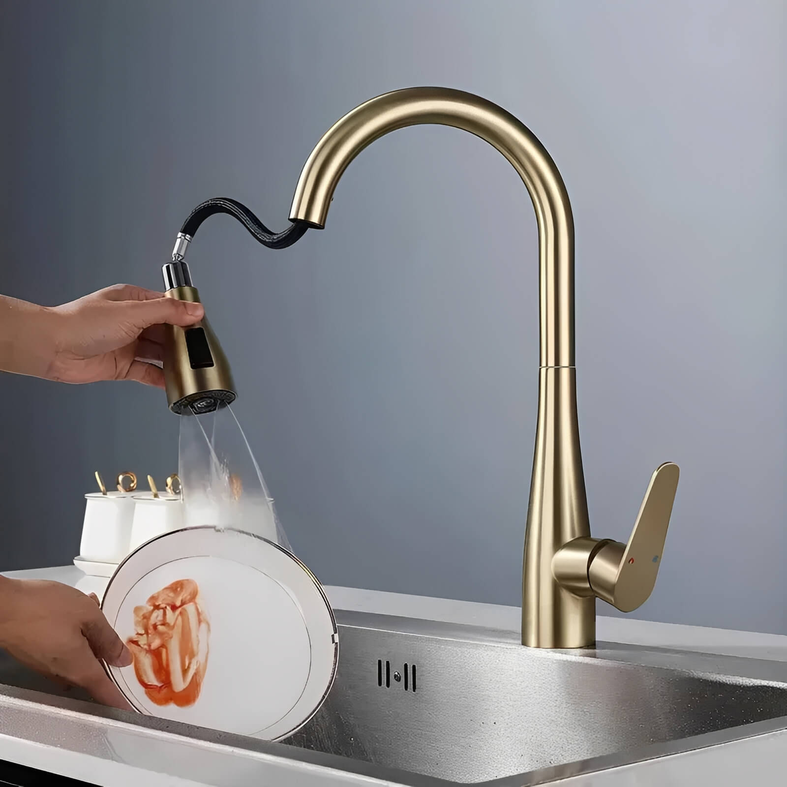 Kitchen faucet with pull-down sprayer and 360° swivel in polished brass