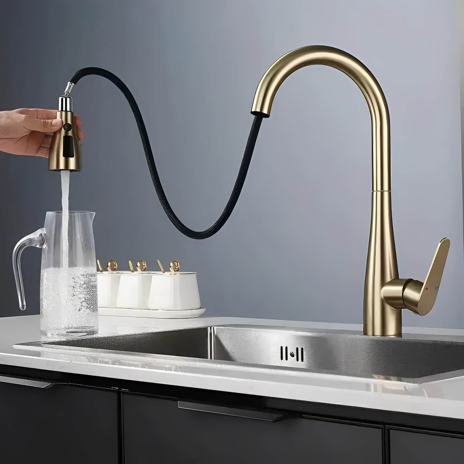 Kitchen faucet with pull-down sprayer and 360° swivel in polished brass