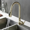 Antique brass kitchen faucet with vintage patina and pull-down sprayer