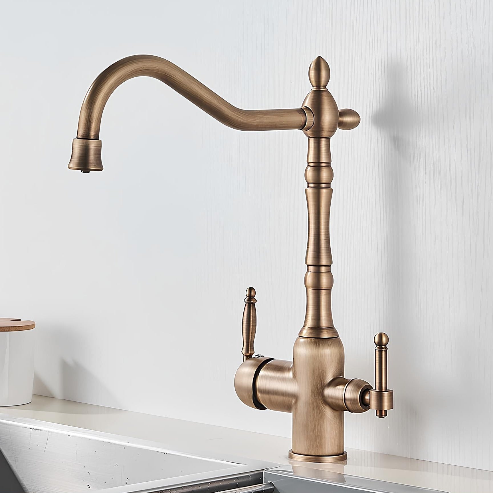 Vintage brass kitchen faucet with dual handles and filtered water outlet